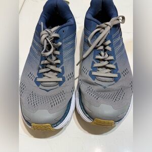 Hoka One One Clifton 6 running shoes, commonly identified in blue and gray